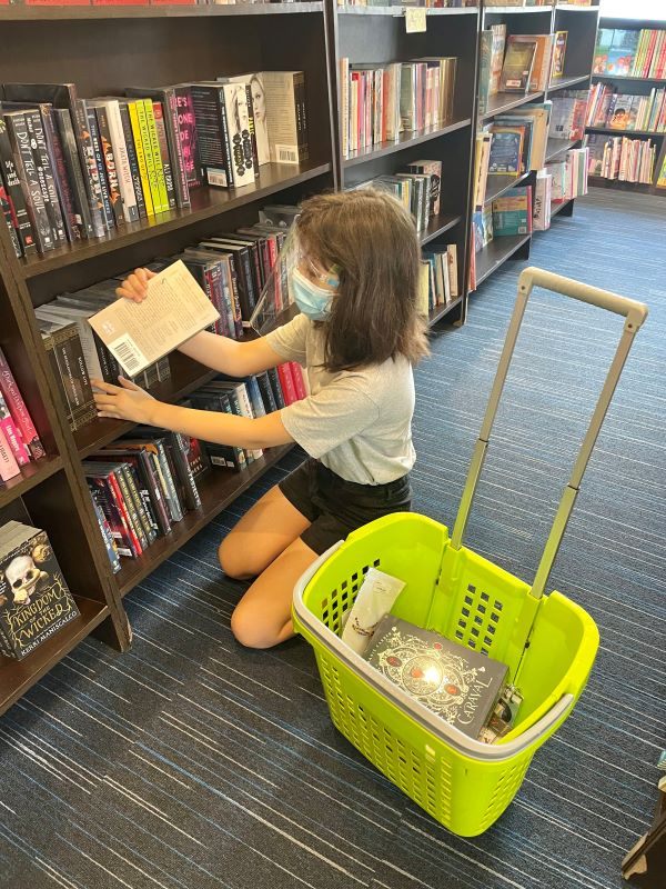 Alba shopping for books at Fuly Booked