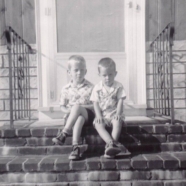 Mickey and Mark sitting on the front steps on Parker Rd
