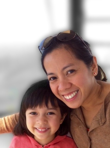 Cher and Alba at 3 years smiling at camera while riding a chairlift in Tagaytay highlands