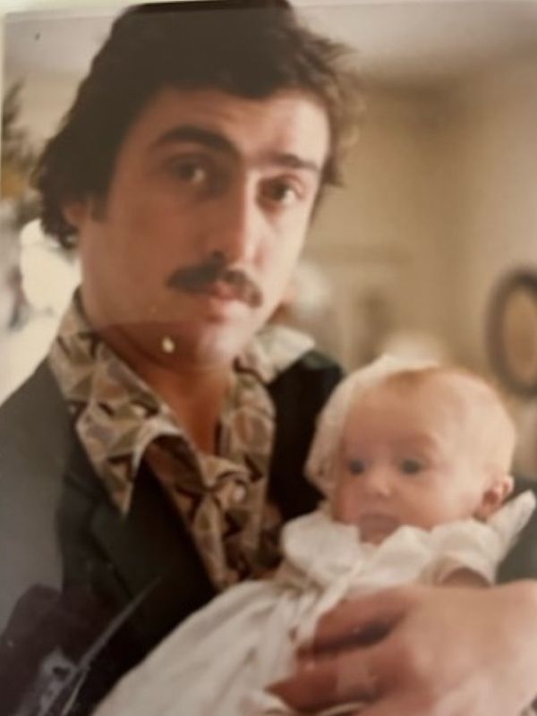 Timmy holding Patrick at is baptism