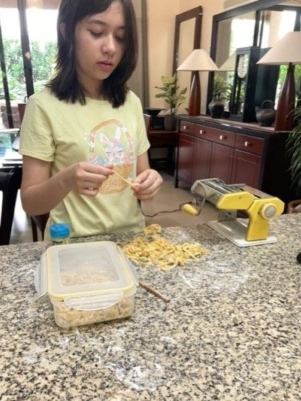 Alba making pasta
