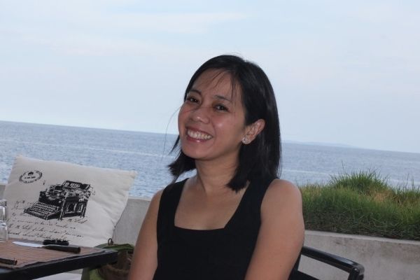 Cher relaxing poolside in Anilao