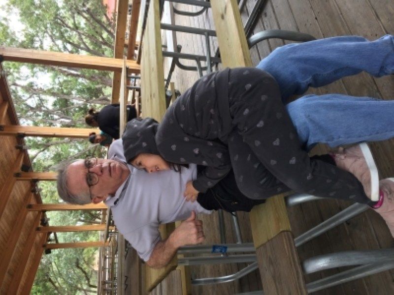 Alba and David sitting on pinic bench in San Antonio